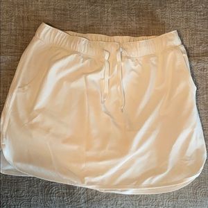 White skirt with shirts underneath